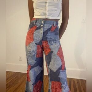 Vintage handmade patchwork denim and bandana print high waisted flare pants.